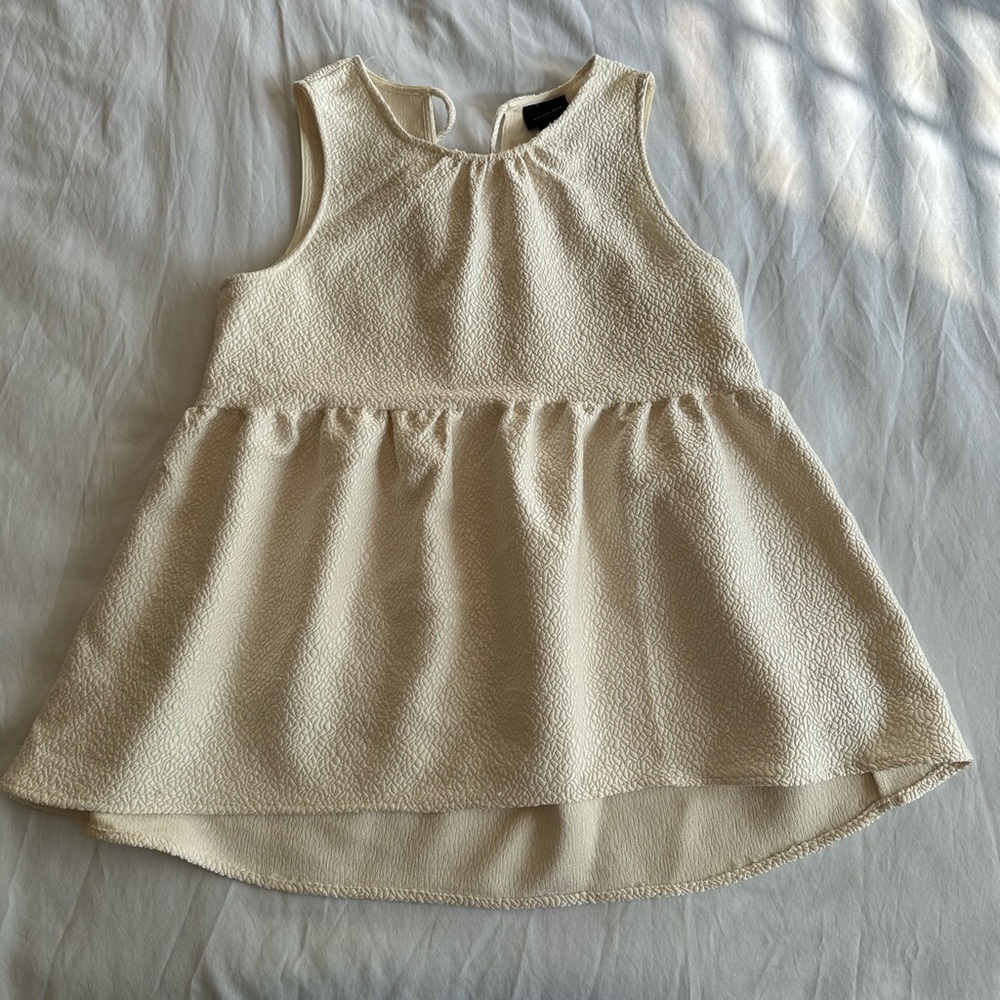 Cream sleeveless top